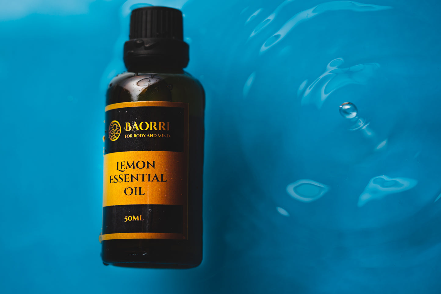 Essential lemon oil in a blue water background 50 ml