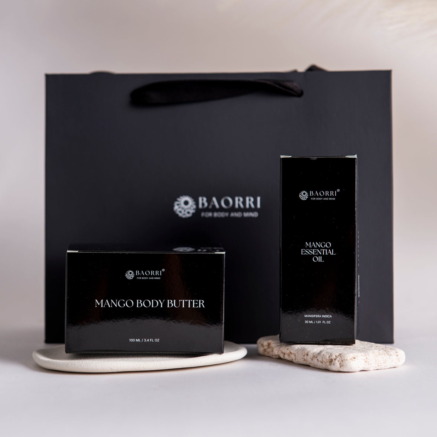 BAORRI Mango Body Butter and Essential Oil packaging on a neutral background
