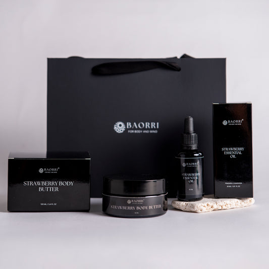 Strawberry essence oil and
Strawberry body butter a light gray background.