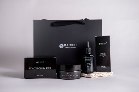 BAORRI Lemon body butter and lemon essential oil a light gray background.